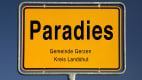 Gelbes Ortsschild von Paradies