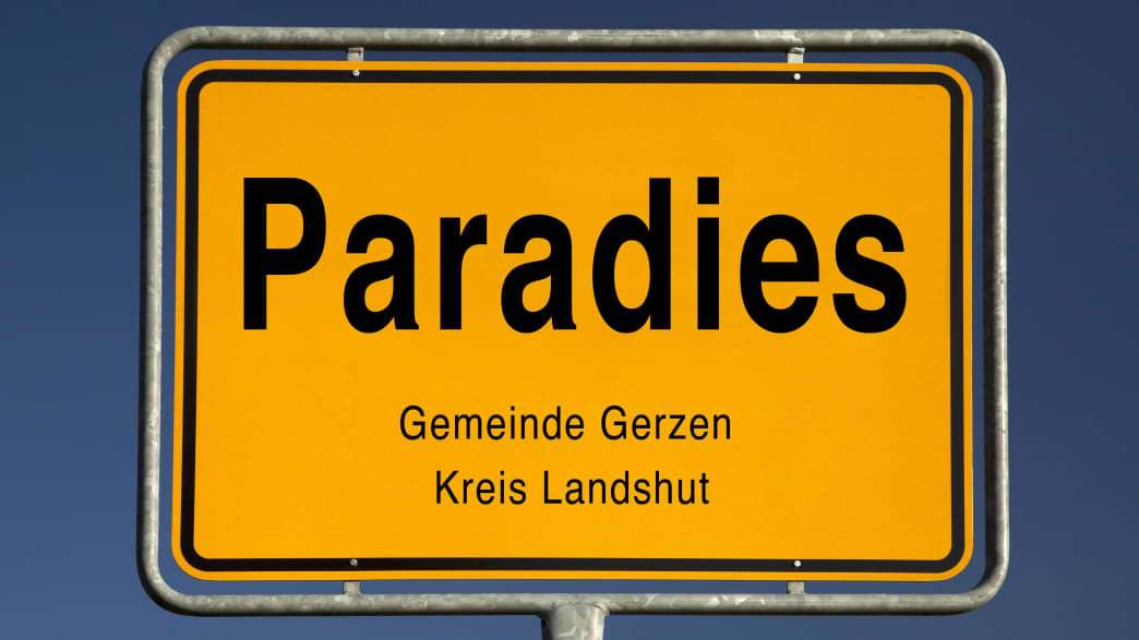 Gelbes Ortsschild von Paradies