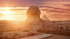 Die Sphinx und Pyramiden bei Sonnenuntergang in Gizeh, Ägypten