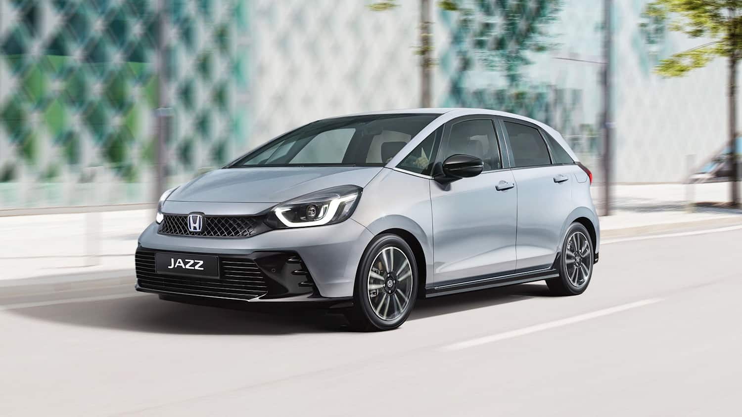 Der fahrend in einer Stadt Honda Jazz
