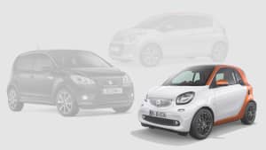 Seat Mii, Citroen C1 und Smart Fortwo auf grauem Hintergrund
