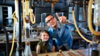 Father and daughter in the research laboratory of the inventor Edison