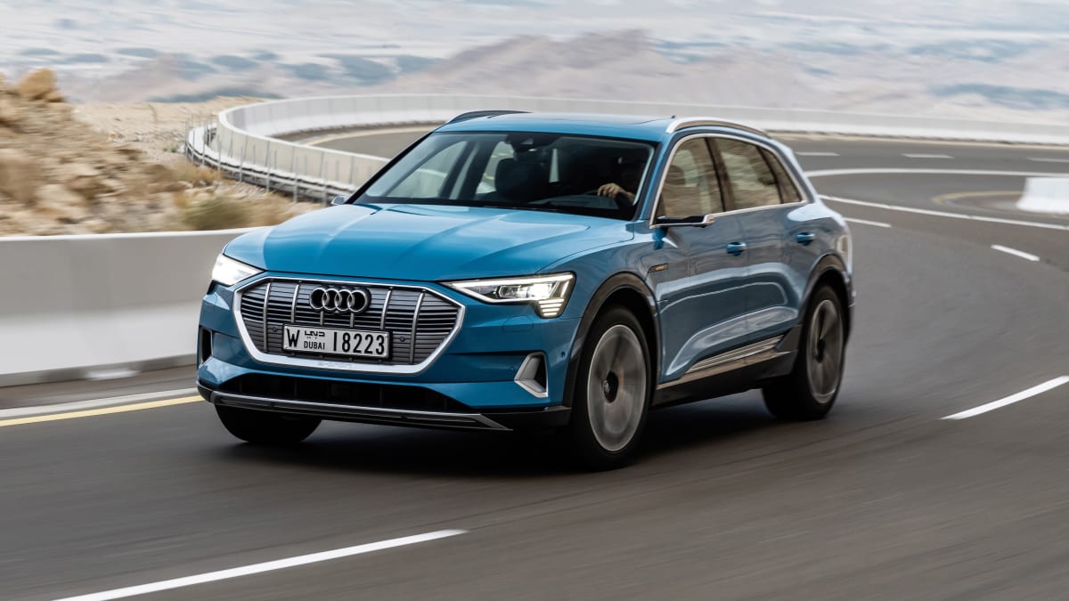 Driving a turquoise Audi e-tron