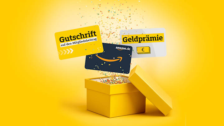 Eine gelbe Geschenkbox, aus der Konfetti und Gutscheine rausspringen