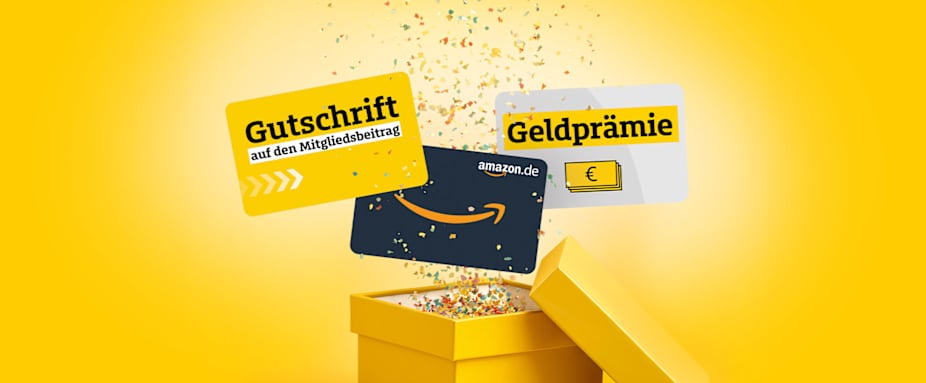 Eine gelbe Geschenkbox, aus der Konfetti und Gutscheine rausspringen